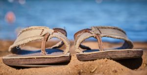 flip flops on sandy beach
