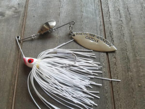 A tackle box with personalized fishing lures.