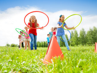 Fourth of July party games, such as a gift exchange, will help bring loved ones closer together.