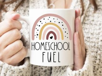 Mom holding Homeschool Fuel coffee mug