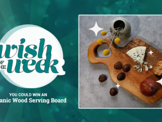 Organic acacia wood serving board with olives