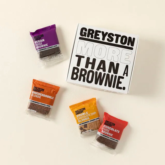 Box of individually wrapped brownies from a bakery that gives back to the community