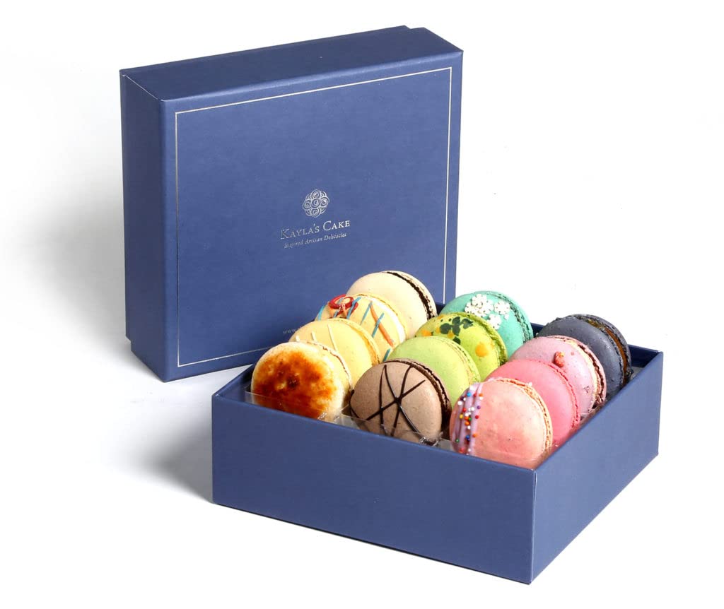 Decorative blue box filled with colorful macarons