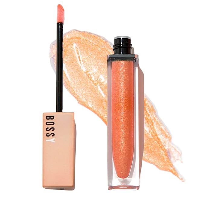 Vibrant orange lip gloss in Leo's power color for the confident zodiac sign