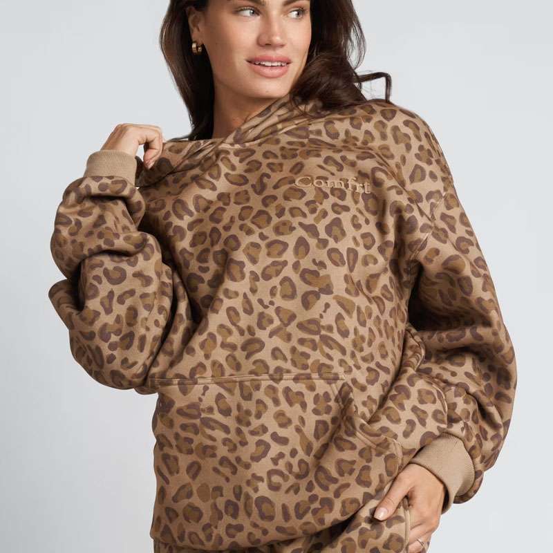 Model wearing a leopard-print Comfrt minimalist hoodie