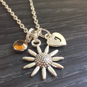Personalized sunflower necklace with a topaz gemstone