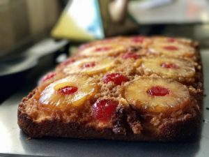 Pineapple upside-down cake with caramelized pineapple rings and cherries