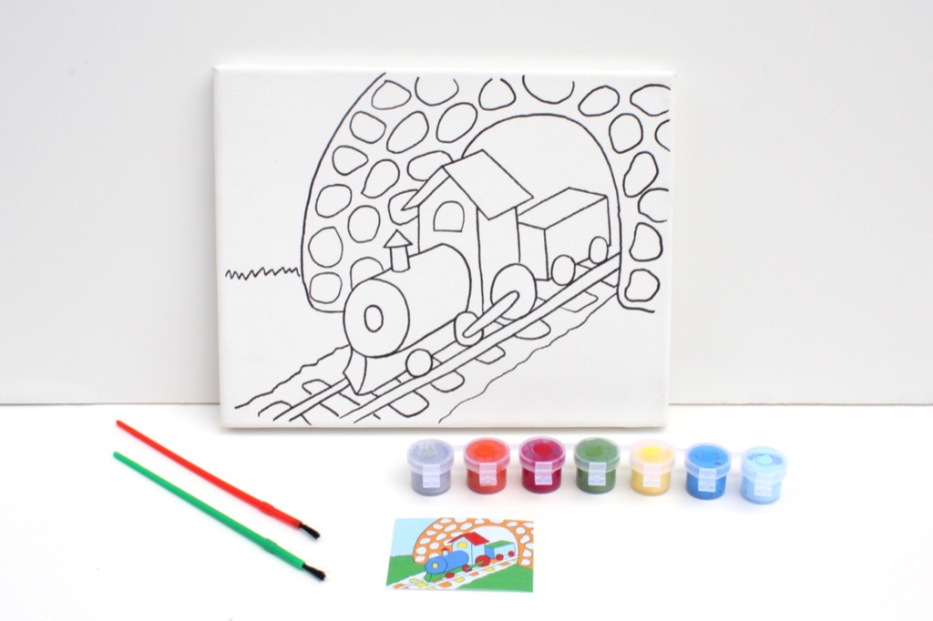A paint-your-own canvas kit with a train design and small paint pots