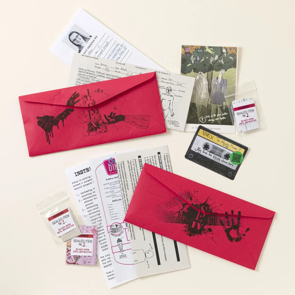 Scarlet Envelope Murder Mystery Game contents laid out