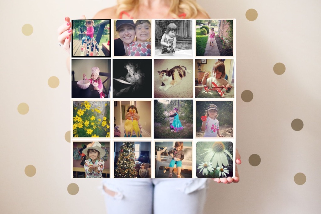 A woman holding a large grid collage print of Instagram photos